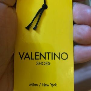 Hunter green Valentino sneakers.